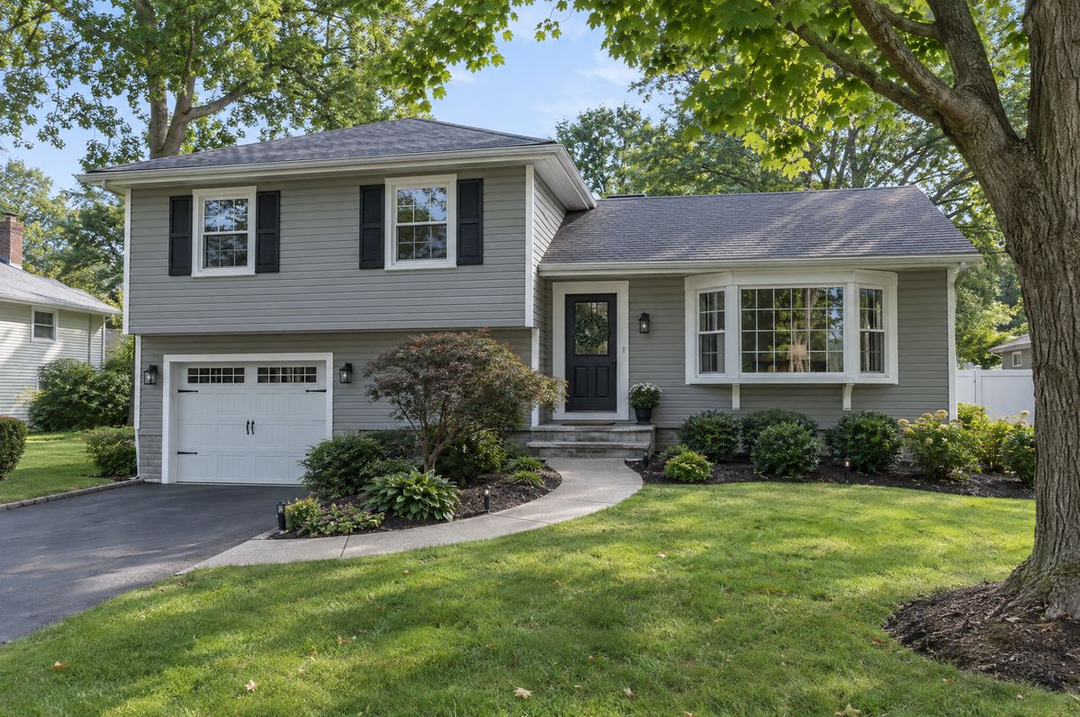 Split-level home with a two-car garage and a small front garden